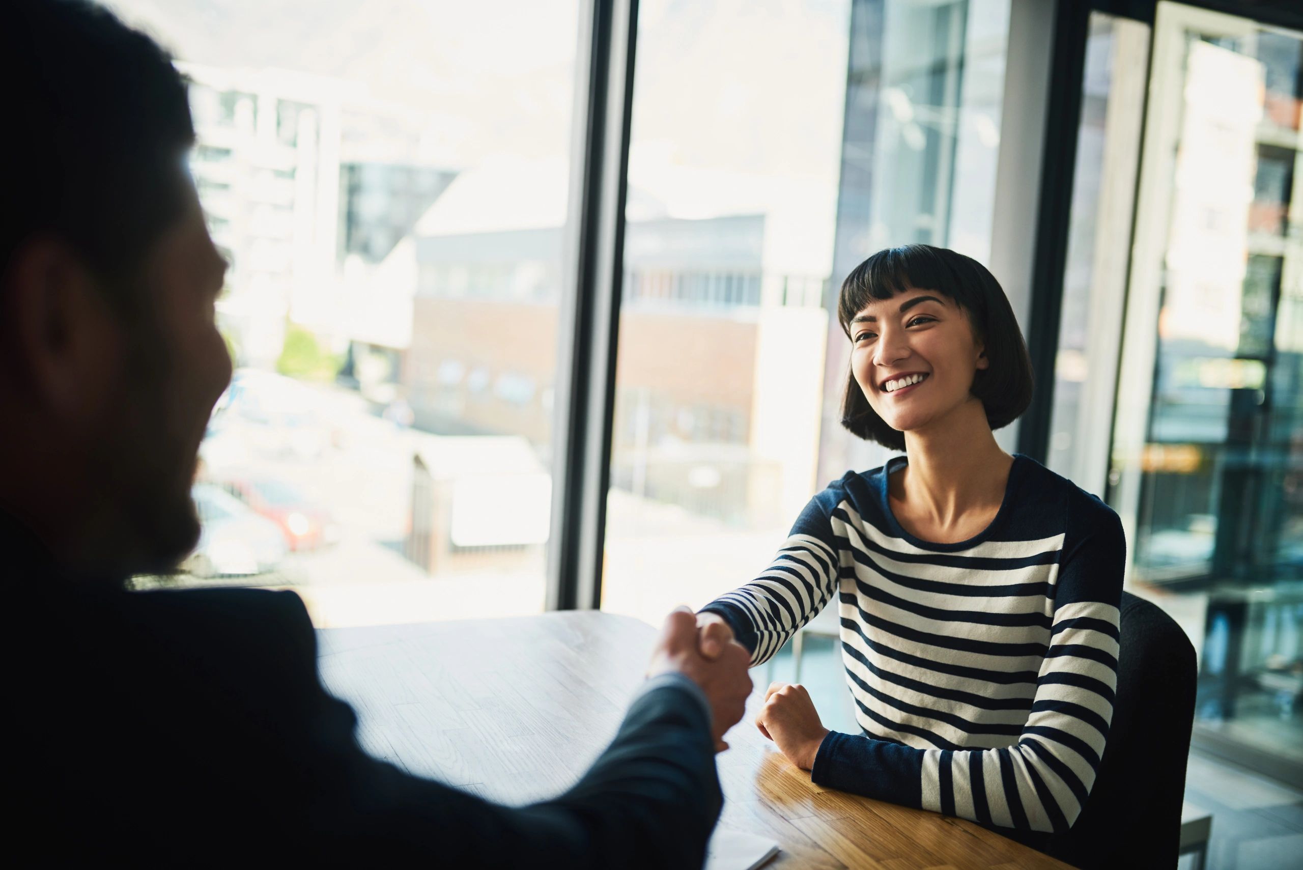 Businesspeople shaking hands after a consultation